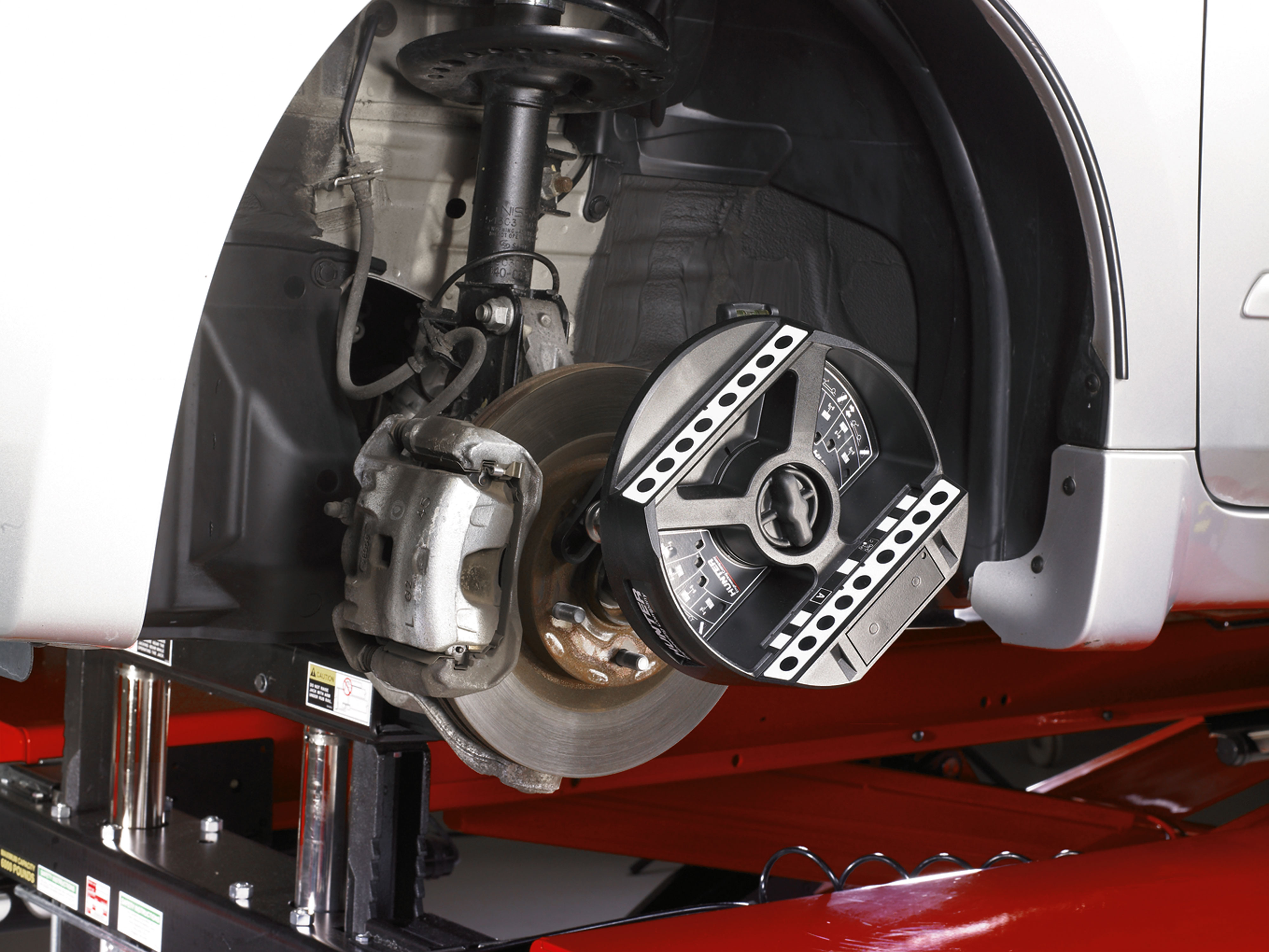 HawkEye Elite three-dimensional wheel target adaptor for wheel-off alignment adjustments
