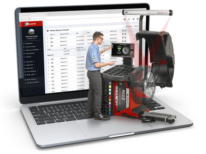 Technician prepping RoadForce WalkAway tire balancer and laptop with HunterNet2 dashboard displayed on screen.